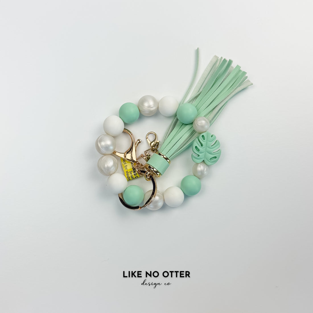 Mint & White Monstera Silicone Wristlet