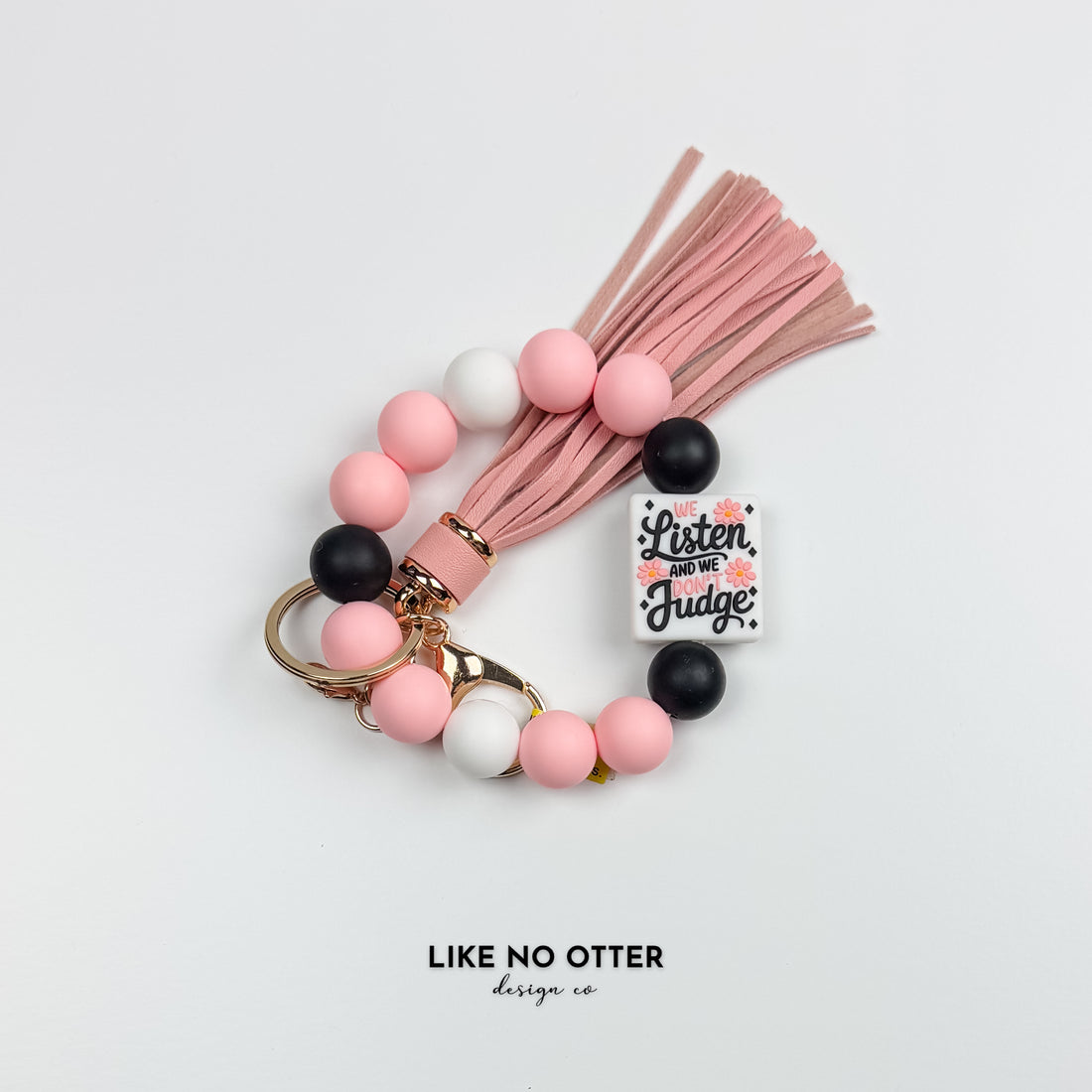 Pink & Black We Listen and We Don't Judge Silicone Wristlet