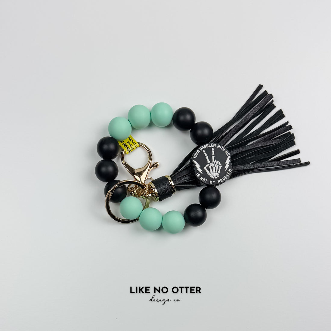 Black & Mint Dual Sided Skeleton Silicone Wristlet