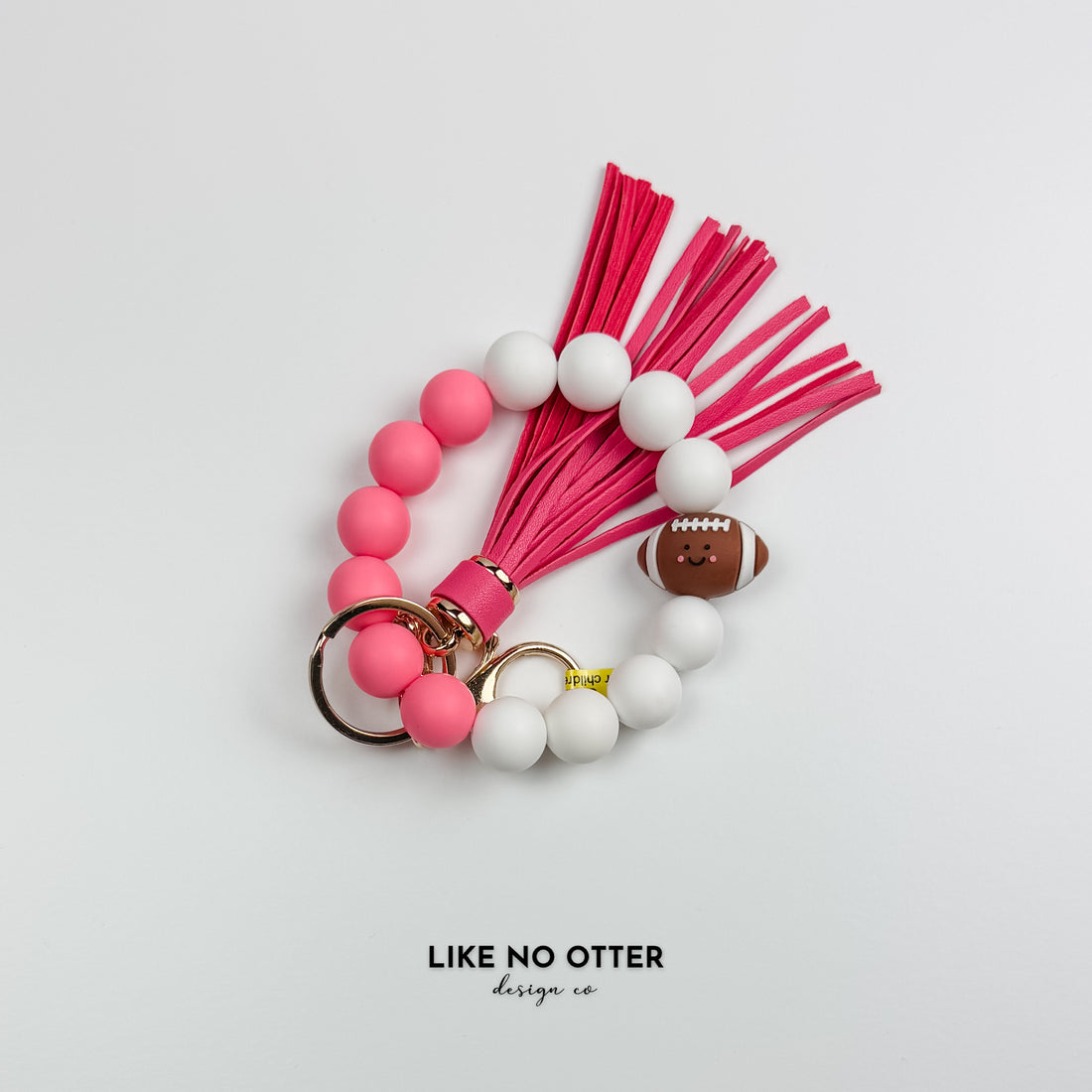 Pink & White Football Silicone Wristlet