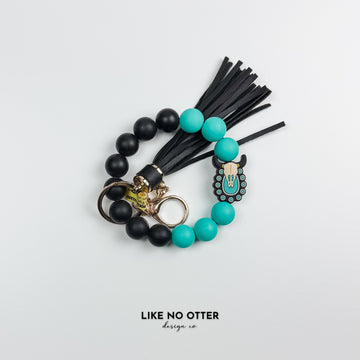 Teal & Black Skull Silicone Wristlet