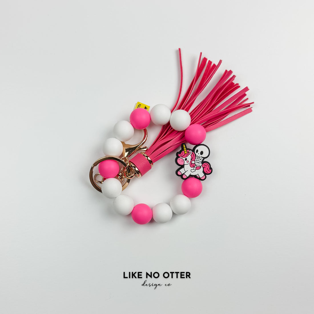 Pink & White Skeleton Riding Unicorn Silicone Wristlet