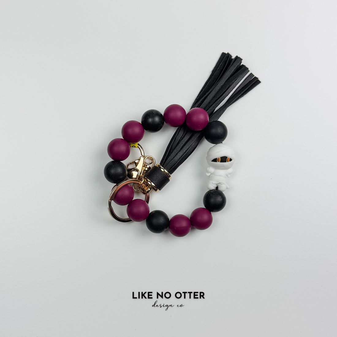 Purple & Black Mummy Silicone Wristlet