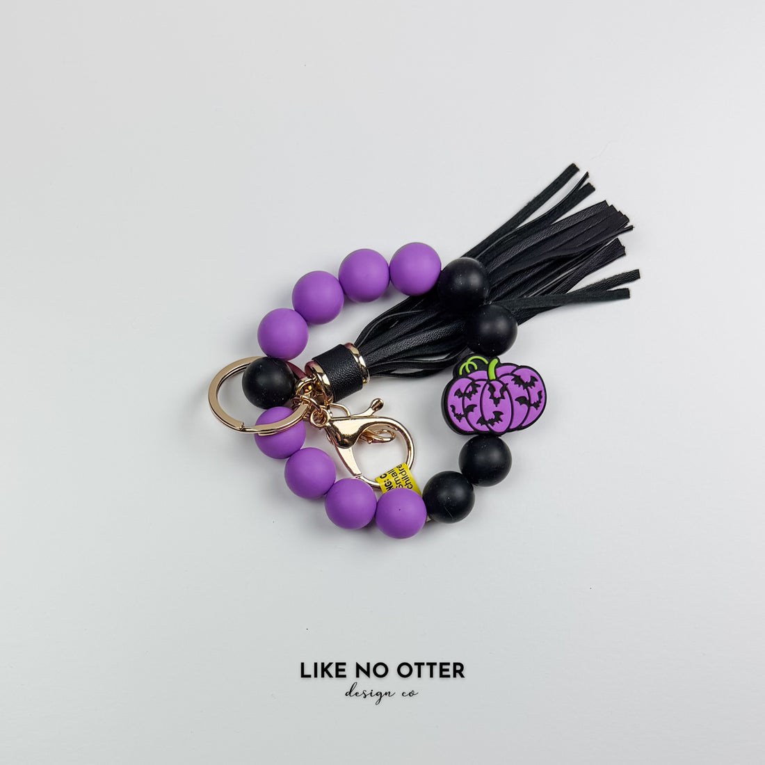 Purple & Black Pumpkin Bats Silicone Wristlet