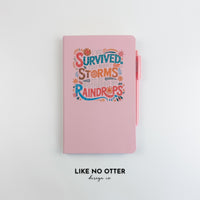 Pink I've Survived Too Many Storms to be Bothered by Raindrops Lined Journal