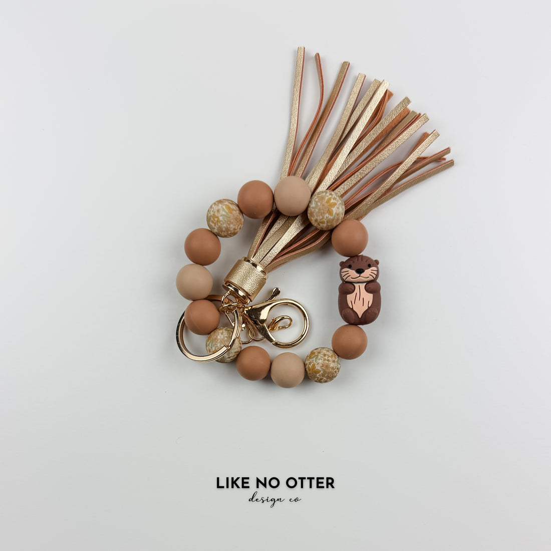 Brown, Floral & Tan Otter Silicone Wristlet