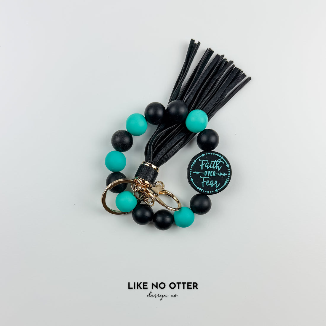 Black & Teal Faith Over Fear Silicone Wristlet