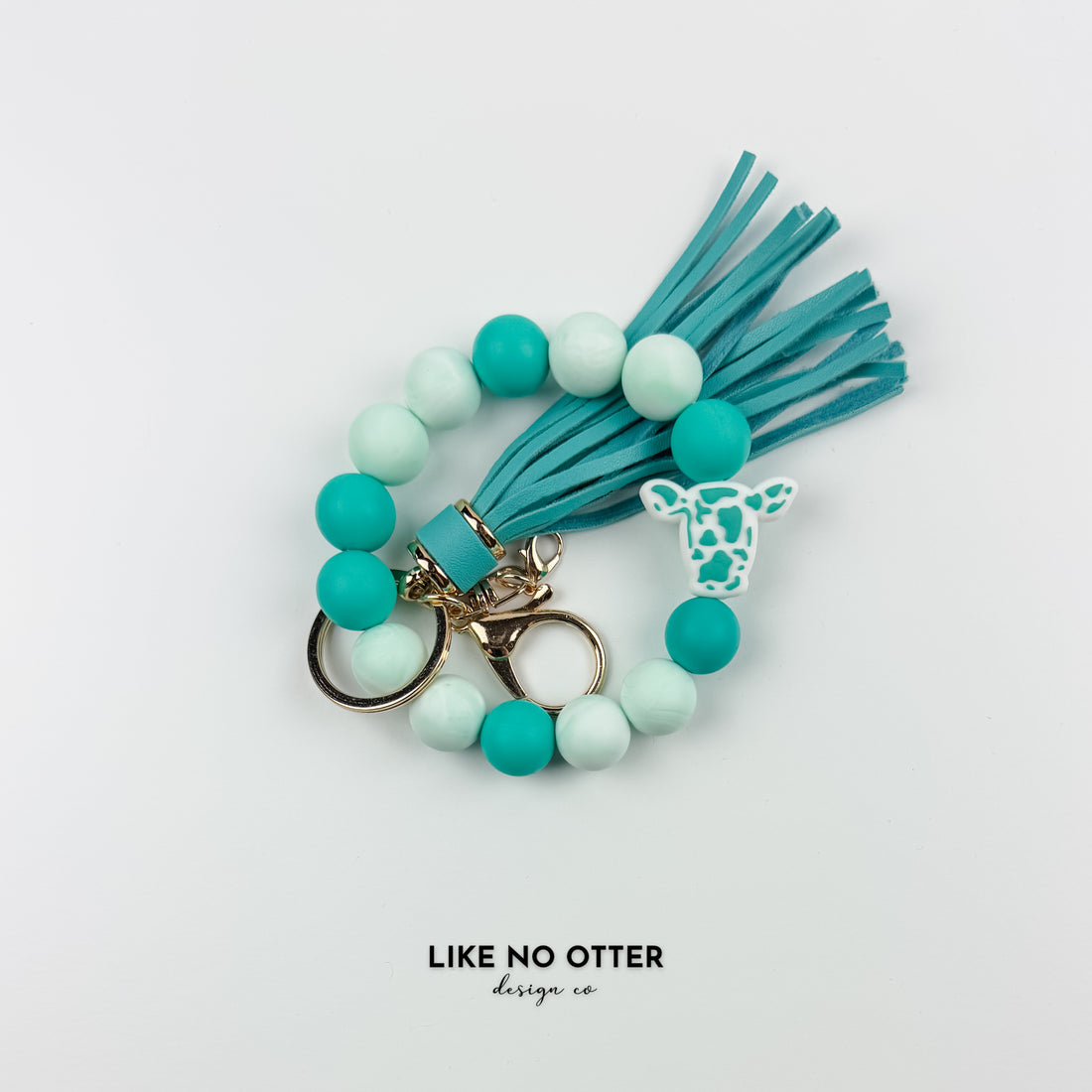 Teal & Marble Cow Print Head Silicone Wristlet