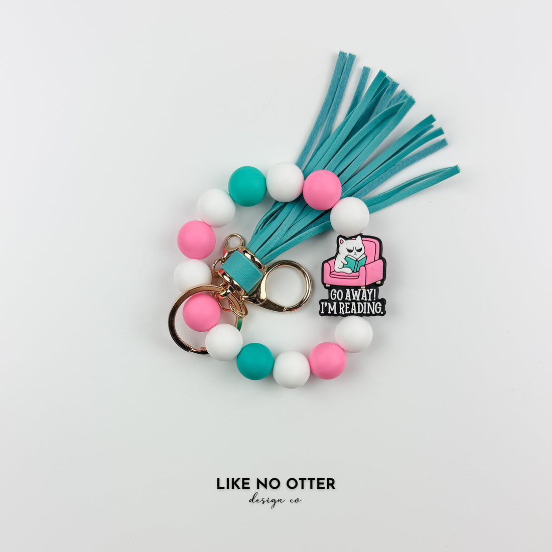 Pink, White & Teal Go Away I'm Reading Cat Silicone Wristlet