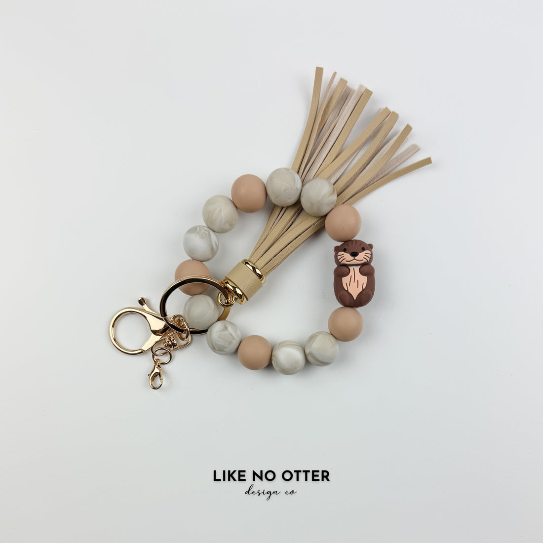 Tan & Marble Otter Silicone Wristlet