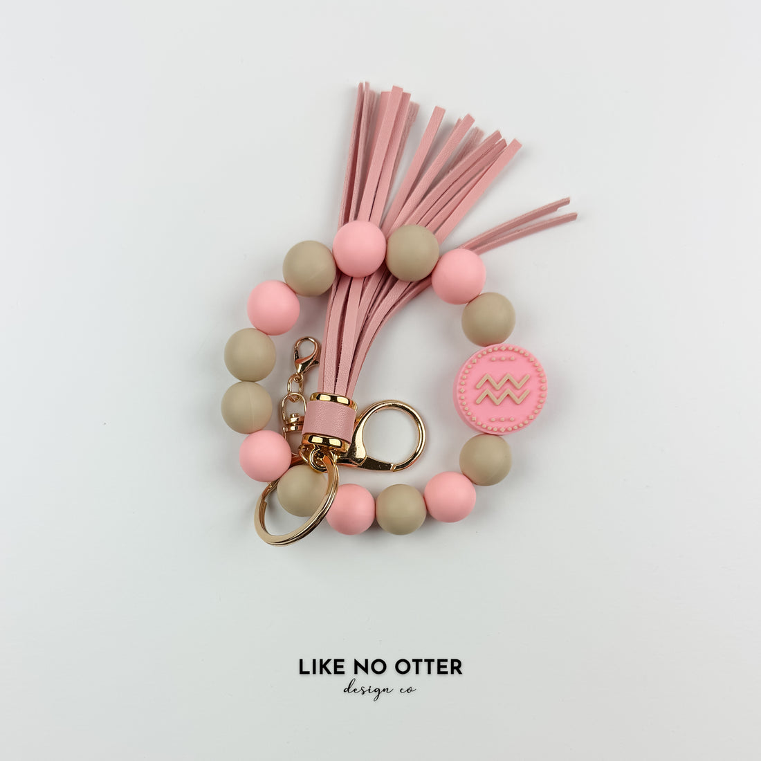 Pink & Tan Aquarius Zodiac Sign Silicone Wristlet