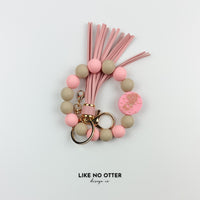 Pink & Tan Aquarius Zodiac Sign Silicone Wristlet