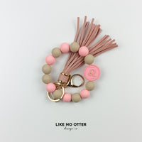 Pink & Tan Leo Zodiac Sign Silicone Wristlet