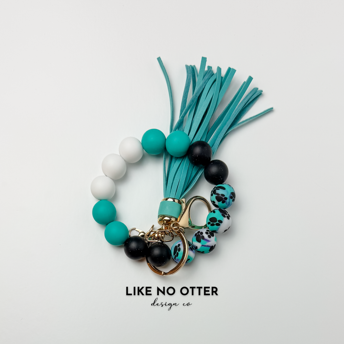 Black, Teal, White, Paw Print Multi Silicone Wristlet