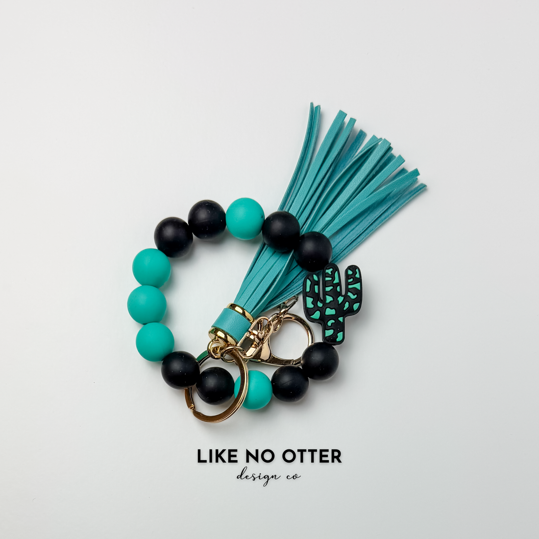 Black, Teal, Cow Print, Cactus Silicone Wristlet