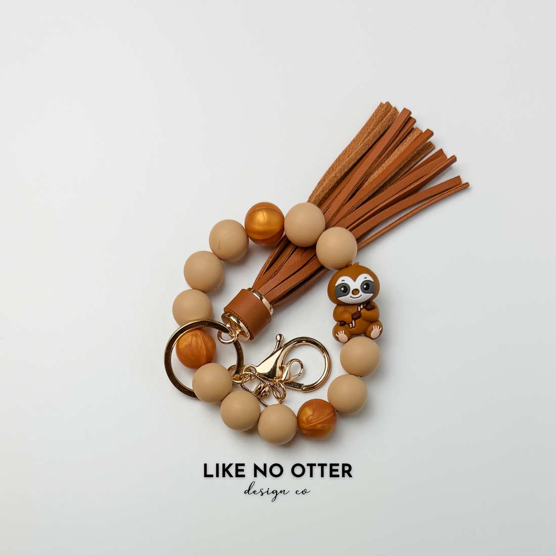 Tan, Brown, Pearl, Sloth Silicone Wristlet