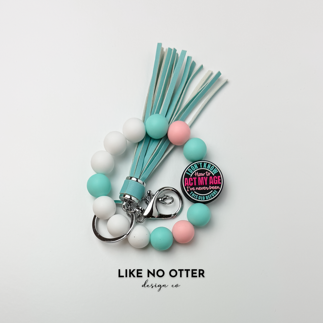 White, Mint, Pink & Black I Don't Know How to Act My Age Silicone Wristlet