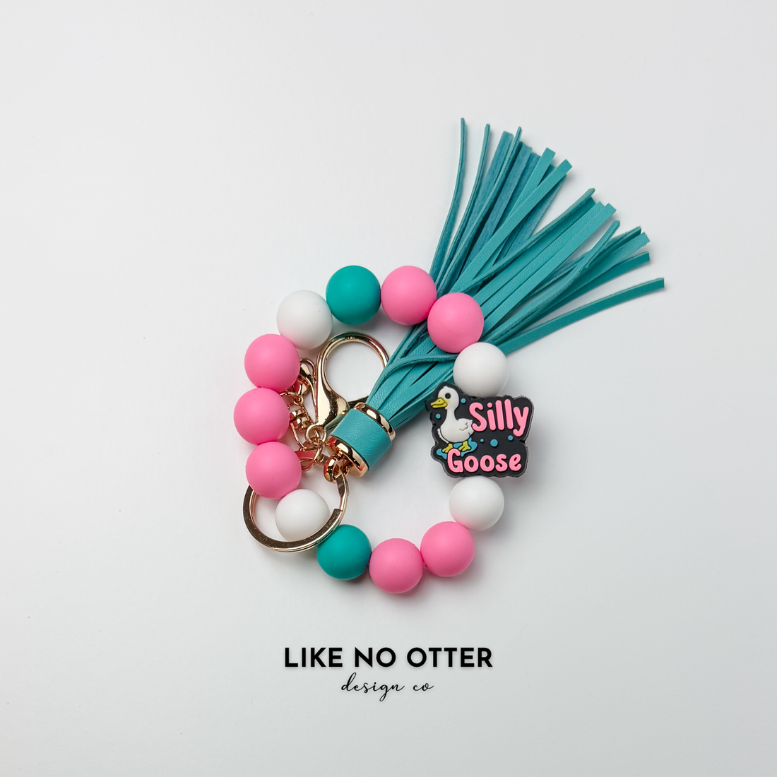Pink, Teal, White, Silly Goose Silicone Wristlet
